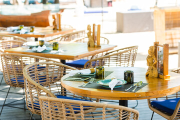 Elegant Dining Setup With Handcrafted Tableware in a Serene Outdoor Space on a Sunny Afternoon.