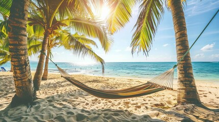 A hammock strung between two palm trees on a beach embodies the ultimate holiday and vacation dream. Bahamas - obrazy, fototapety, plakaty