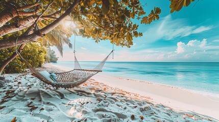 A tropical beach setting is enhanced by a beach swing or hammock, white sand, and a calm sea,...