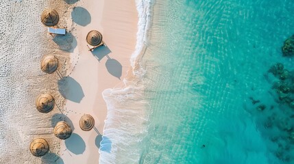 An aerial perspective showcases a breathtaking beach with umbrellas and lounge chairs near the...