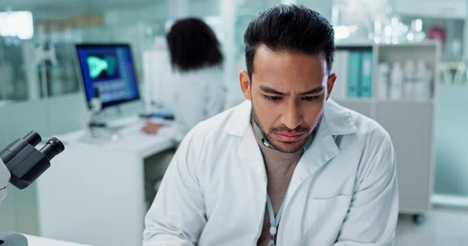 Scientist, man and reading computer for laboratory test, typing report or medical results of DNA at night. Asian expert thinking on computer for science research, biotechnology and molecule analysis