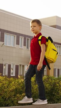 boy child kid backpack going school, schoolgirls with bags, friendship amongst pupils, girlhood, education companions, education preparation, students going to class, grassy schoolyard, backpacks on