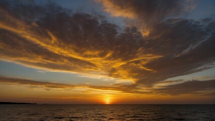 Obraz premium Golden sunset over calm ocean horizon