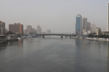 Fototapeta na wymiar The Nile, Bridge, Buildings, Sand Storm