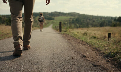 National Walking Day, people walking on gravel tarmac road on a summers day