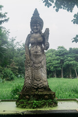 Stone sculpture in the Monkey Forest, Ubud, Bali, Indonesia.