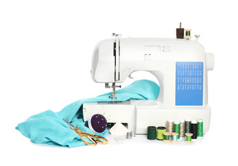 Modern sewing machine with light blue cloth and craft accessories isolated on white