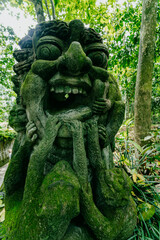 Fototapeta na wymiar Monkey statues in Monkey Forest, Ubud, Bali, Indonesia.