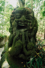 Fototapeta na wymiar Monkey sculpture in Monkey Forest. Ubud, Bali, Indonesia.