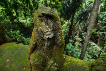 Fototapeta na wymiar Sculpture of Monkey in the Monkey Forest. Ubud, Bali, Indonesia.