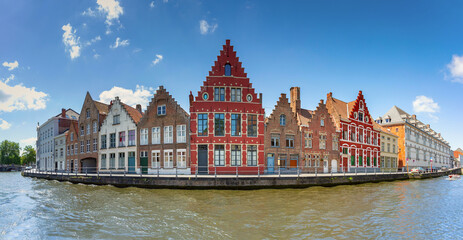 Panorama of Bruges canal with beautiful medieval colored houses in the morning, Belgium