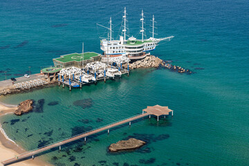 High-angle view of the restaurant in the shape of a ship on the sea