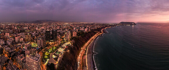 Coast of Lima with barranco and chorillos buildings by night