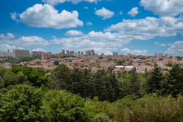 Fototapeta na wymiar Ankara, Anatolia, Turkey. June 2, 2019: General landscape of the city. Trees, houses and sky.