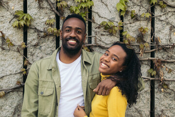 afro american couple portrait smiling and holding each other