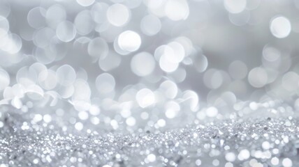 Silver Glitter Bokeh Background - Elegant abstract silver glitter with soft bokeh lights.