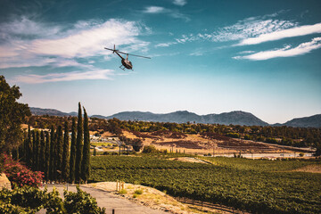 helicopter flying over winery