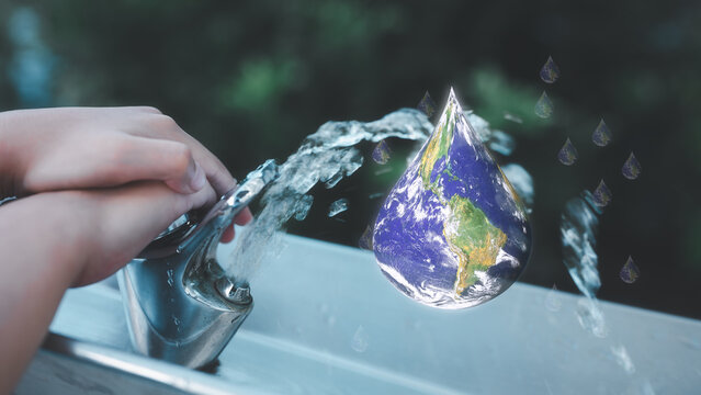 save water save earth concept saving our planet earth children hand press tab water and drop water with world map inside, elements of the image furnished by nasa