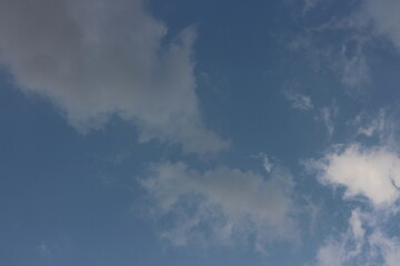 Natural daylight and white clouds floating on blue sky.
