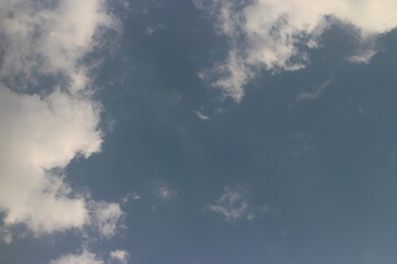 Natural daylight and white clouds floating on blue sky.