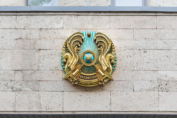 Coat of arms of the Republic of Kazakhstan on the administrative building.