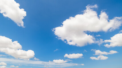 Panoramic view of clear blue sky and clouds, Blue sky background with tiny clouds. White fluffy clouds in the blue sky. Captivating stock photo featuring the mesmerizing beauty of the sky and clouds. - obrazy, fototapety, plakaty