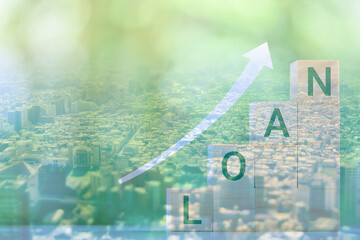 This image is a collage of a cityscape seen from above and an image of rising interest rates. The...