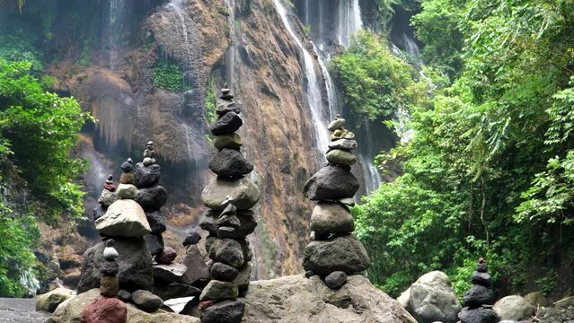 Goa Tetes waterfall surrounded by a forest, rocks stacked in a natural landscape. Java Island, Lumajang Province