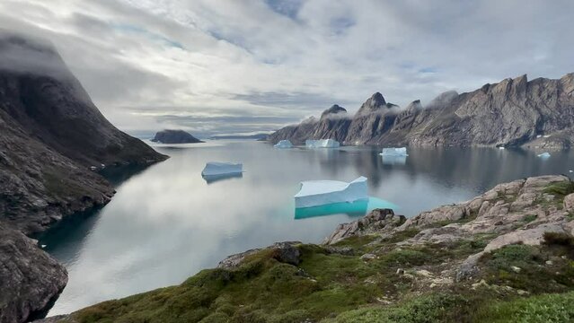 Static view of the fjord with icebergs at Bear Islands. Scoresbysund, Greenland.