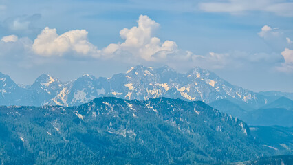 Panoramic view of majestic mountain peaks of Julian Alps seen from on top of Feistritzer Spitze (Hochpetzen), Karawanks, Carinthia, border Austria Slovenia. Looking at unique rock formation Grintovec