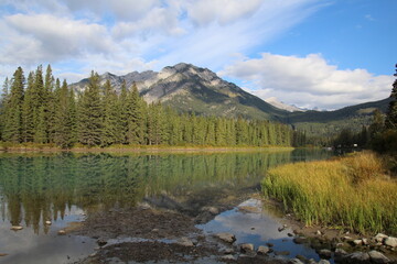 Reflections On The Bow River, Banff National Park, Alberta