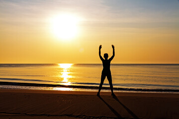 Woman exercise with sunrise at beach Bang Boet