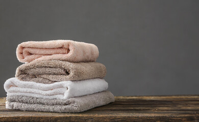 An Immaculate Display of Neatly Stacked White Towels on a Background, Isolated from Surrounding
