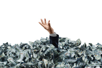 A businessman's hand is sticking out of a pile of dollars. Concept of winning the lottery,...