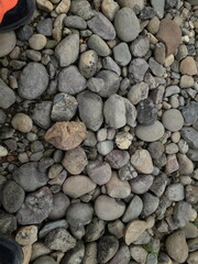 abstract Textured background with round pebble stones. Vacation holiday recreation on beach concept. High quality photo. Fragment with a texture of rock.