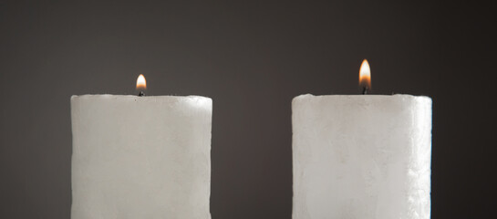 White burning decorative beautiful candle.