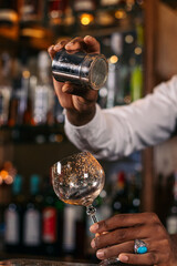 The magic of mix: a bartender preparing his best creations