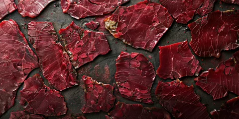 Schilderijen op glas Close up of freshly cut pieces of red meat on a white plate, ready for cooking © SHOTPRIME STUDIO