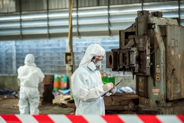 Man inspector scientist investigate chemical gas leak spill with safety face mask PPE suit in area closed barricade security red white tape. danger area infected toxic leak spill cross stripe ribbon