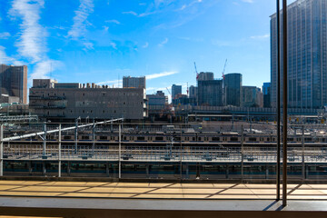 Cityscape with Takanawa Gateway Station at Japanese City of Tokyo on a sunny winter day. Photo taken February 16th, 2024, Tokyo, Japan.