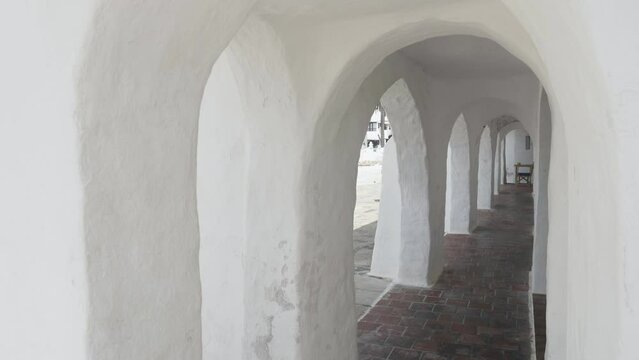 Passage corridor with rounded arches in Binibeca village, Menorca island