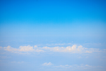 Naklejka na ściany i meble Flying Plane-Above the Sea of Clouds