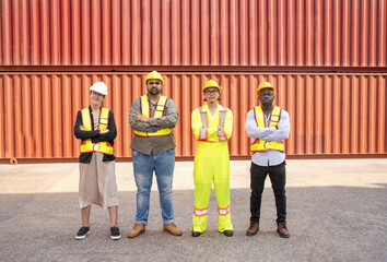 Obraz premium group of diverse container yard workers standing with arms crossed in front of shipping container yard,concept of success of work,pride in work,container in export and import business and logistics