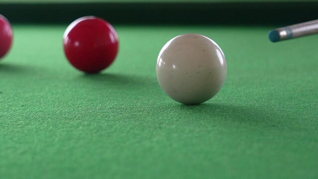 Snooker shooting on snooker at green table in super slow motion 240fps 8bit colors shoot