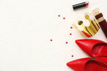 Paper crown with stylish high heels, lipstick and bottle of perfume on white background. Prom concept © Pixel-Shot
