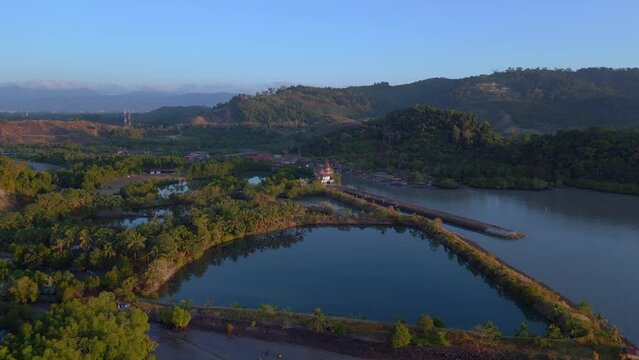 serene islands calm water Sunrise morning light. Smooth aerial top view flight drone shot footage from above
4k