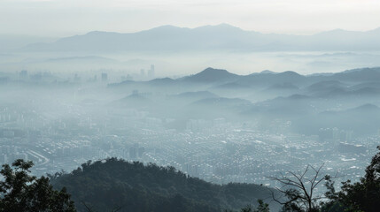 A panoramic view of a city covered in smog as seen from the mountains