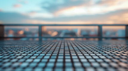 The golden light of sunset washes over a blurred city, shining through a sharply detailed metal grid in the foreground