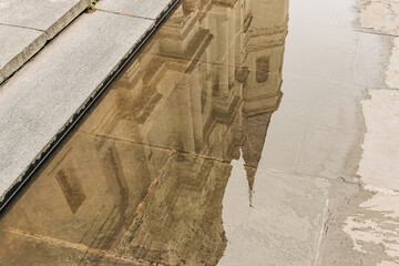 Saint Louis Cathedral reflection in puddle in New Orleans