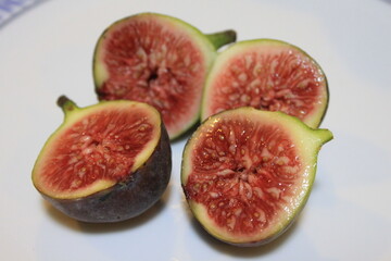 basket of fresh ripe figs fruit on a wooden table
